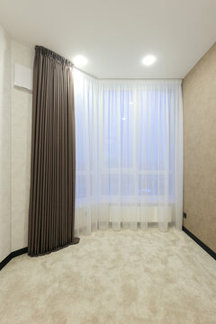 Empty apartment room window curtains