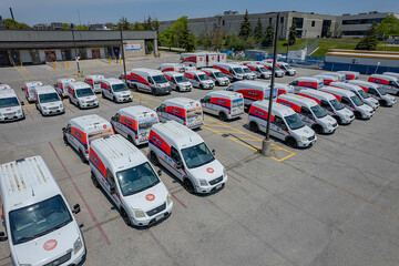 Fototapeta premium Canada Post delivery vans in a Toronto parking lot. The Crown corporation is ending door-to-door delivery for community mailboxes: Toronto, Ontario, Canada - May 17, 2026