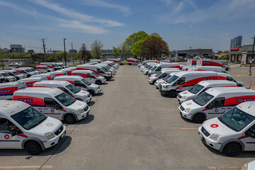 Obraz premium Canada Post delivery vans in a Toronto parking lot. The Crown corporation is ending door-to-door delivery for community mailboxes: Toronto, Ontario, Canada - May 17, 2026