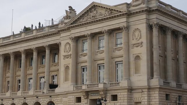 Ornate 18th century Hotel de Crillon facade featuring classical architecture and rooftop terrace