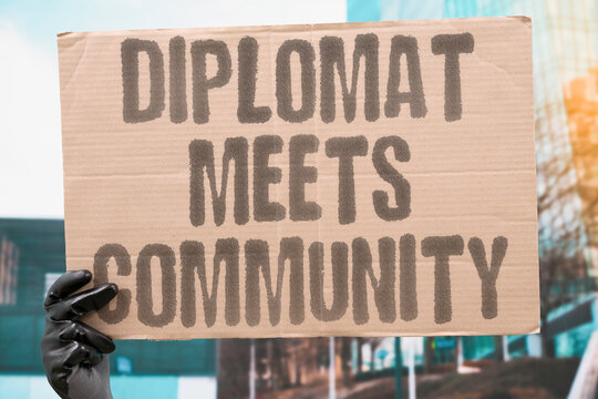 "Diplomat meets community" Diplomat meets community but makes no binding promises. DIPLOMACY. LISTENING. NEUTRALITY. AMBIGUITY. DIPLOMATIC.