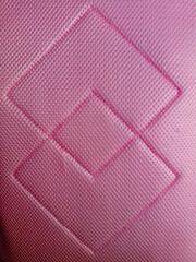 Obraz premium Close Up of Pink Diamond Quilted Mesh Fabric Texture for Bags