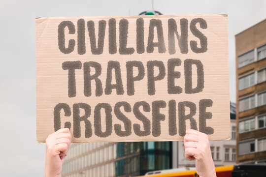 "Civilians trapped crossfire" Innocents caught between opposing forces unable to escape. CIVILIAN. HELPLESSNESS. CROSSFIRE. TRAPPED. VULNERABILITY.