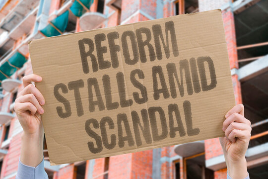 "Reform stalls amid scandal" Progress on structural changes halts during corruption revelations. REFORM. STAGNATION. SCANDAL. PROGRESS. HALT.