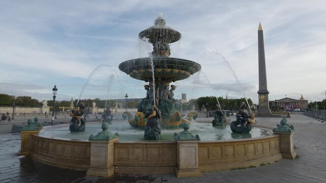 Fontaine des Mers flowing at Place de la Concorde with the Luxor Obelisk in Paris