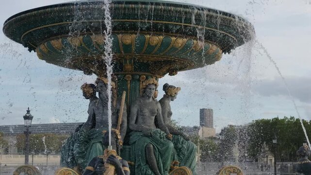 Fontaine des Mers with classical sculptures and water spraying in historic Parisian square