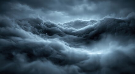 Fototapeta premium Dark stormy clouds filling the sky, dense atmospheric vapor layers with moody blue and grey tones creating a rolling wave-like texture across the horizon