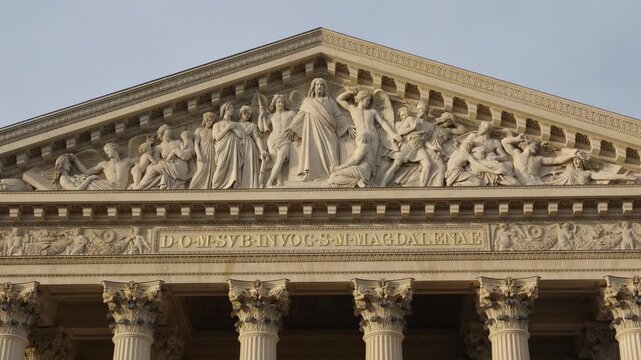 Iconic sculpture of the Last Judgment adorning the pediment of Eglise de la Madeleine in Paris