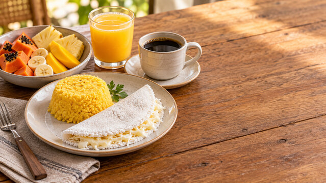 Traditional Brazilian Breakfast with Tapioca Cheese Cuscuz and Tropical Fruit