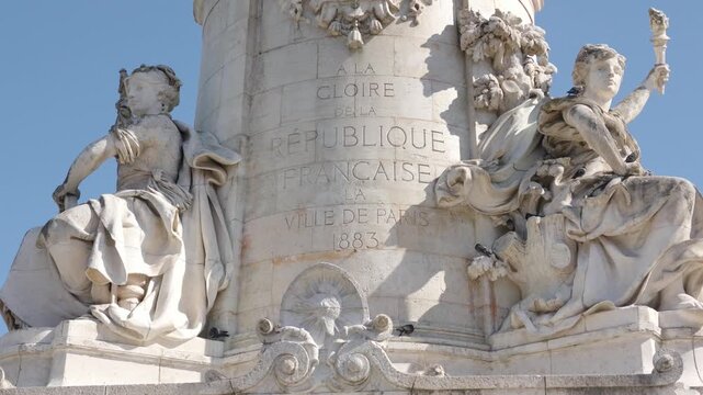 Monument a la Republique details, showcasing allegorical figures and inscription in Paris, France