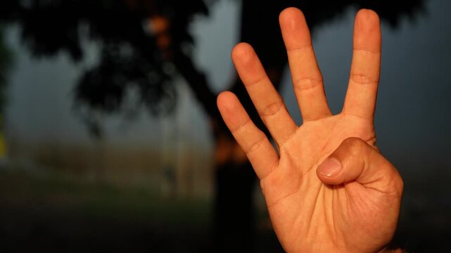 Close-Up of Hand Countdown From 5 to 0 Using Fingers Outdoor