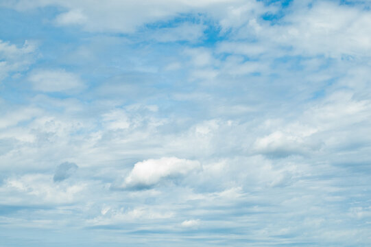 The photo shows a blue sky and clouds