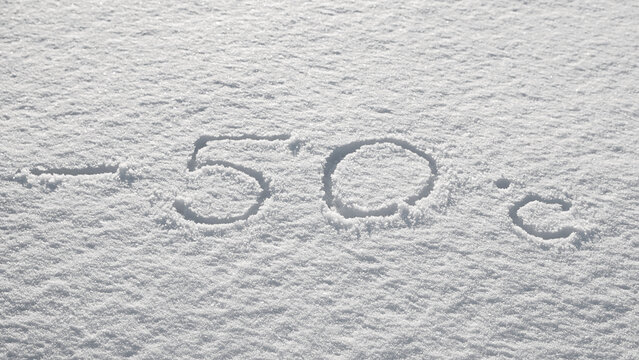 Background with snow, photo of snow texture in winter and numbers indicating that the temperature is -50 degrees Celsius