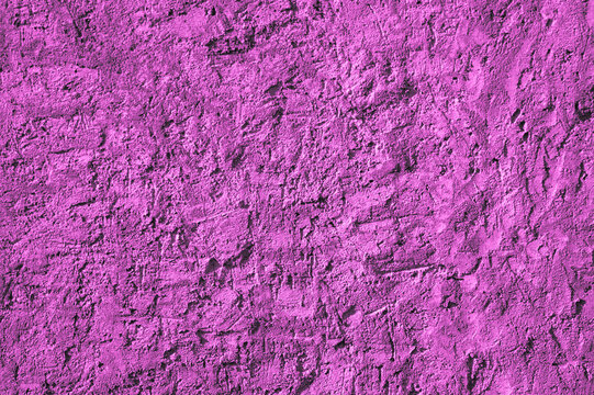 Purple background, photo of the texture of an old wall with various lines, embossing, and brushstrokes