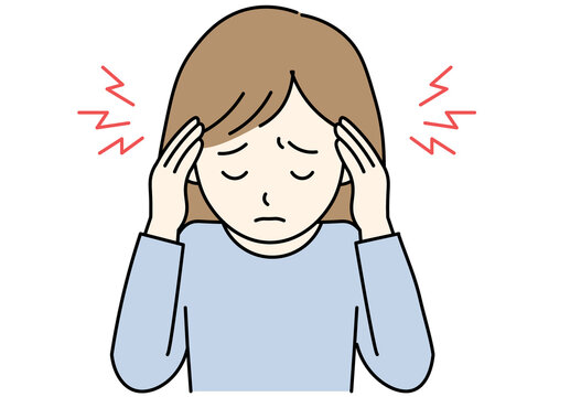woman holding her head in pain due to a severe headache or migraine attack.