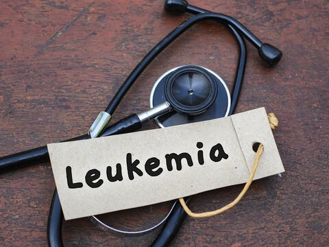 Stethoscope on wood with leukemia word. medical concept