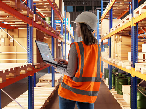 Warehouse. Inventory management. Warehouse supervisor checks stock levels and storage locations with a laptop, monitoring inventory, pallet racks and logistics operations.