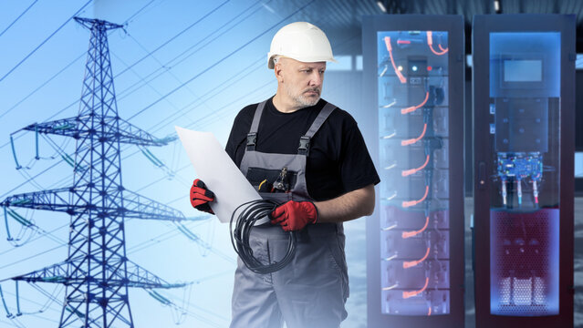 Energy storage. Battery energy system. Engineer inspects battery storage equipment for electrical power accumulation, grid stabilization and renewable energy integration.