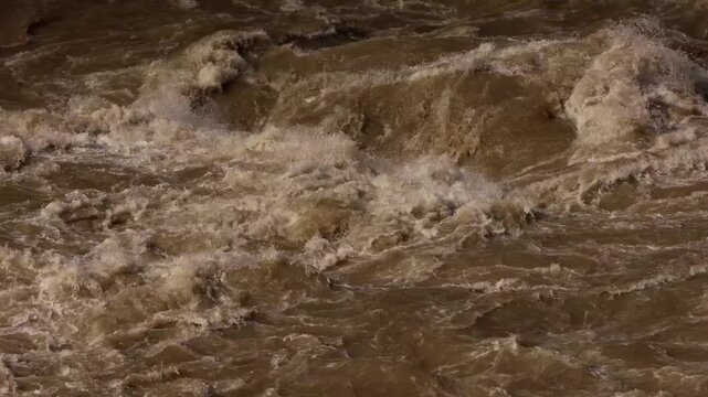 Close-up video captures the Beas River flowing rapidly with muddy water after heavy monsoon rainfall in Mandi, Himachal Pradesh, India.