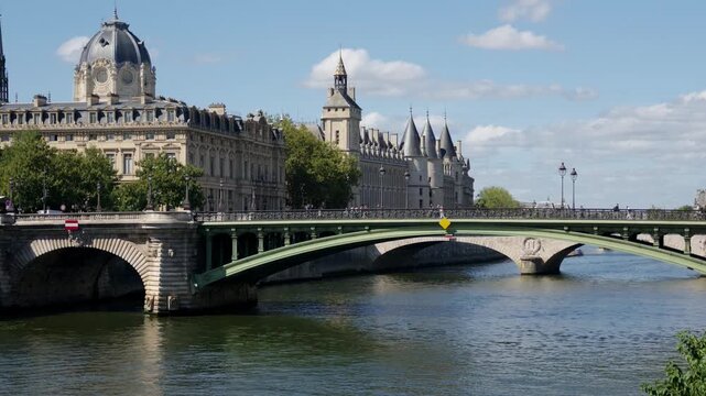 Seine river flowing past the Conciergerie and Palais de Justice in Paris, France