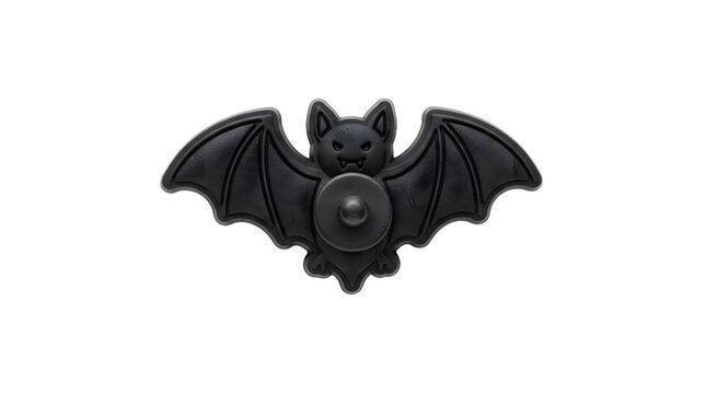 Black bat pin isolated on white background for Halloween decoration and fashion accessory.