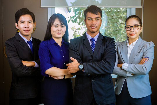Asian teamwork is ready concept. Smart Asian business peoples standing, preparing for work together.