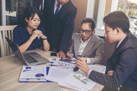 Business peoples meeting to discuss the situation on business plan, marketing for investment. Selected focus