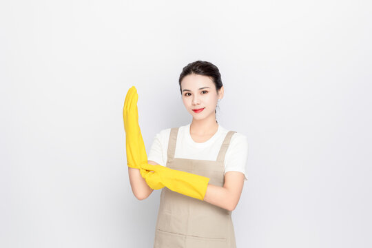 Image of a young Chinese woman doing housework