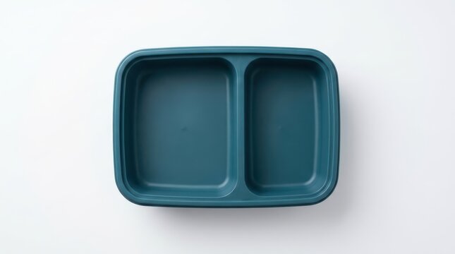 Top view of an empty teal plastic bento box with two compartments isolated on white background