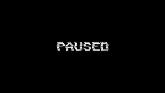 paused glitch text message with a retro effect on black background. ideal for gaming streams, intros, vintage 8-bit paused text pixel 4k video