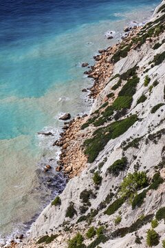Steep coastline and turquoise-coloured water at Cap Blanc, Ibiza, Balearic Islands, Mediterranean, Spain