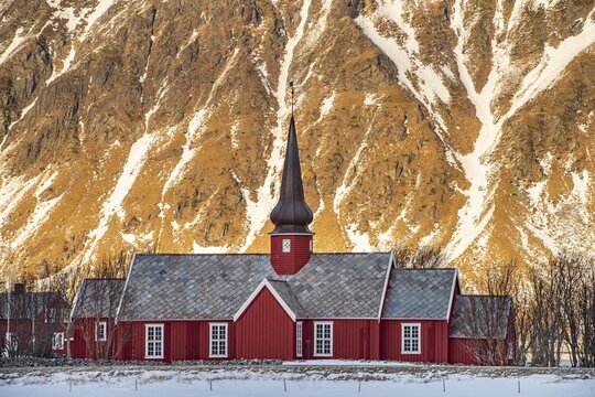 Winter Scandinavian landscape with stave church, Flakstad Church, church, mountains, snow, Flakstad, Nordland, Lofoten, Norway