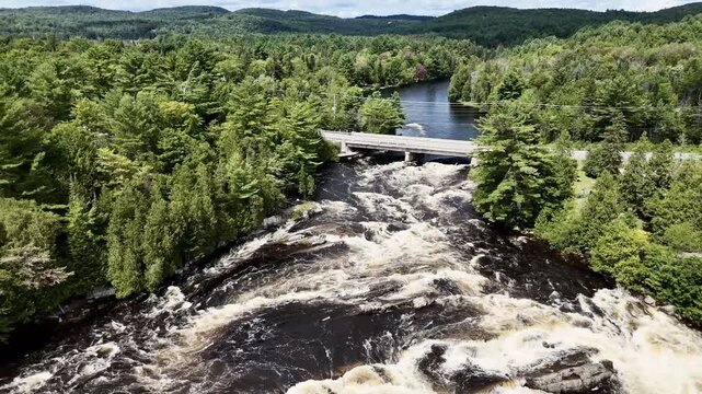 Drone flight above cascades and waterfalls park on the Ouareau River, in Rawdon, Quebec, Canada.