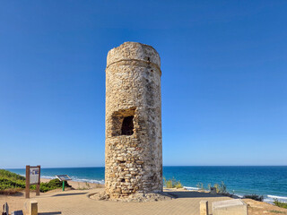 medieval, tower, called, Torre, del, Puergo in La Barrosa beach in Sancti Petri, Cadiz, Spain © josevgluis
