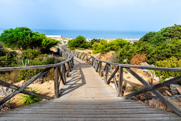 sand dunes that give access to La Barrosa beach in Sancti Petri, Cadiz, Spain © josevgluis