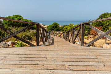 sand dunes that give access to La Barrosa beach in Sancti Petri, Cadiz, Spain © josevgluis