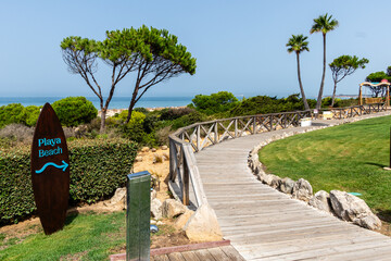 sand dunes that give access to La Barrosa beach in Sancti Petri, Cadiz, Spain © josevgluis