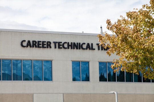Career Technical Training building exterior in Fremont California featuring large institutional lettering on beige facade with autumn foliage