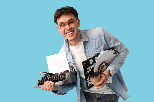 Male screenwriter with scenario and typewriter on blue background