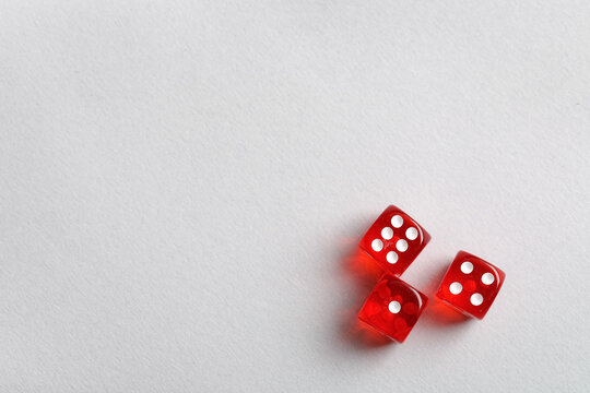 Red game dices on grey background