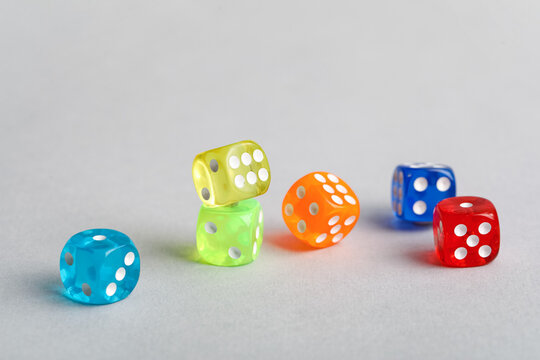 Colorful game dices on grey background