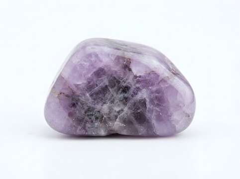 Polished purple amethyst gemstone isolated on white background