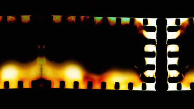 Abstract Vintage Film Burn Transition with Light Leaks and Sprocket Holes and film rell