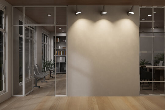 Minimalist office interior with spotlight shinning on empty wall and glass partition over wood floor