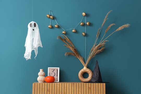 Interior of room decorated for Halloween with ghost and commode