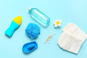 Obraz premium Composition with bottles of cosmetic products and bath accessories for baby on color background