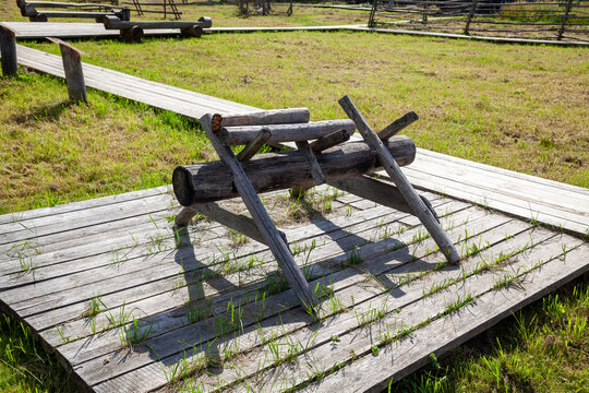 Wooden Sawhorses Near Traditional Village House