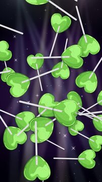 Green Heart Lollipops Falling Over Sparkling Purple Background Animation