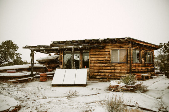 Rustic Log Cabin in Winter Snow