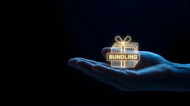 Human hand holding glowing digital bundling icon against dark background